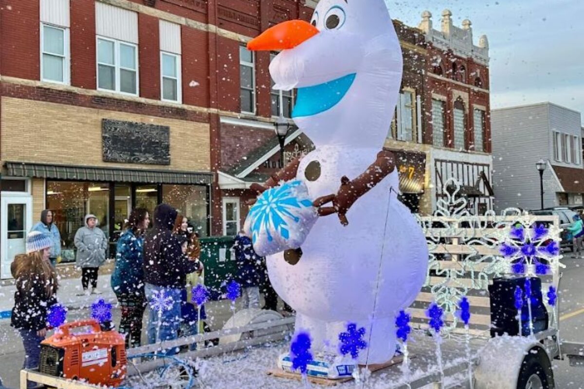 Olaf riding on a trailer in Santa Parade